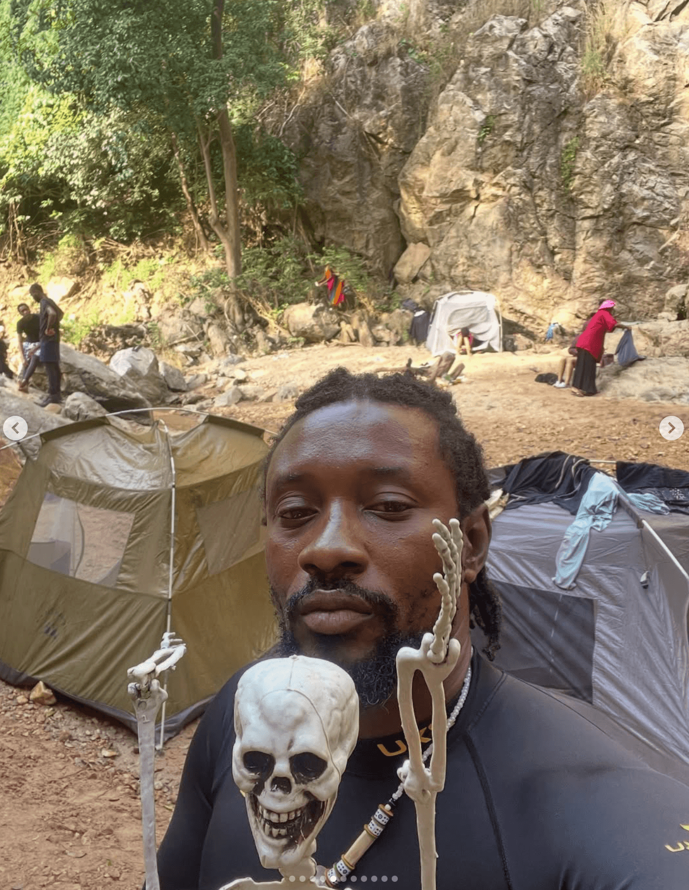 Friends gathered around a glowing campfire at night