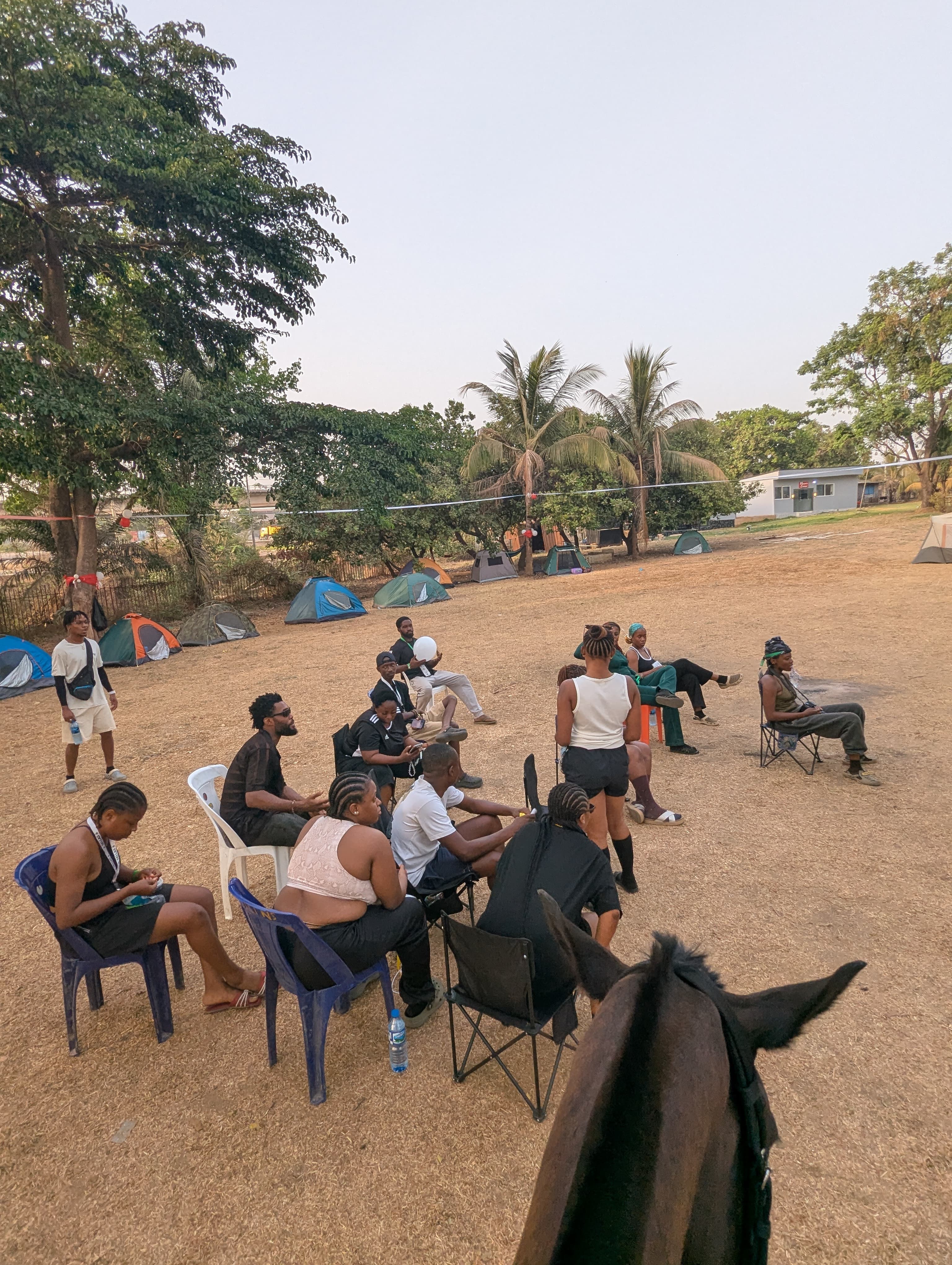 Group of campers laughing and connecting outdoors