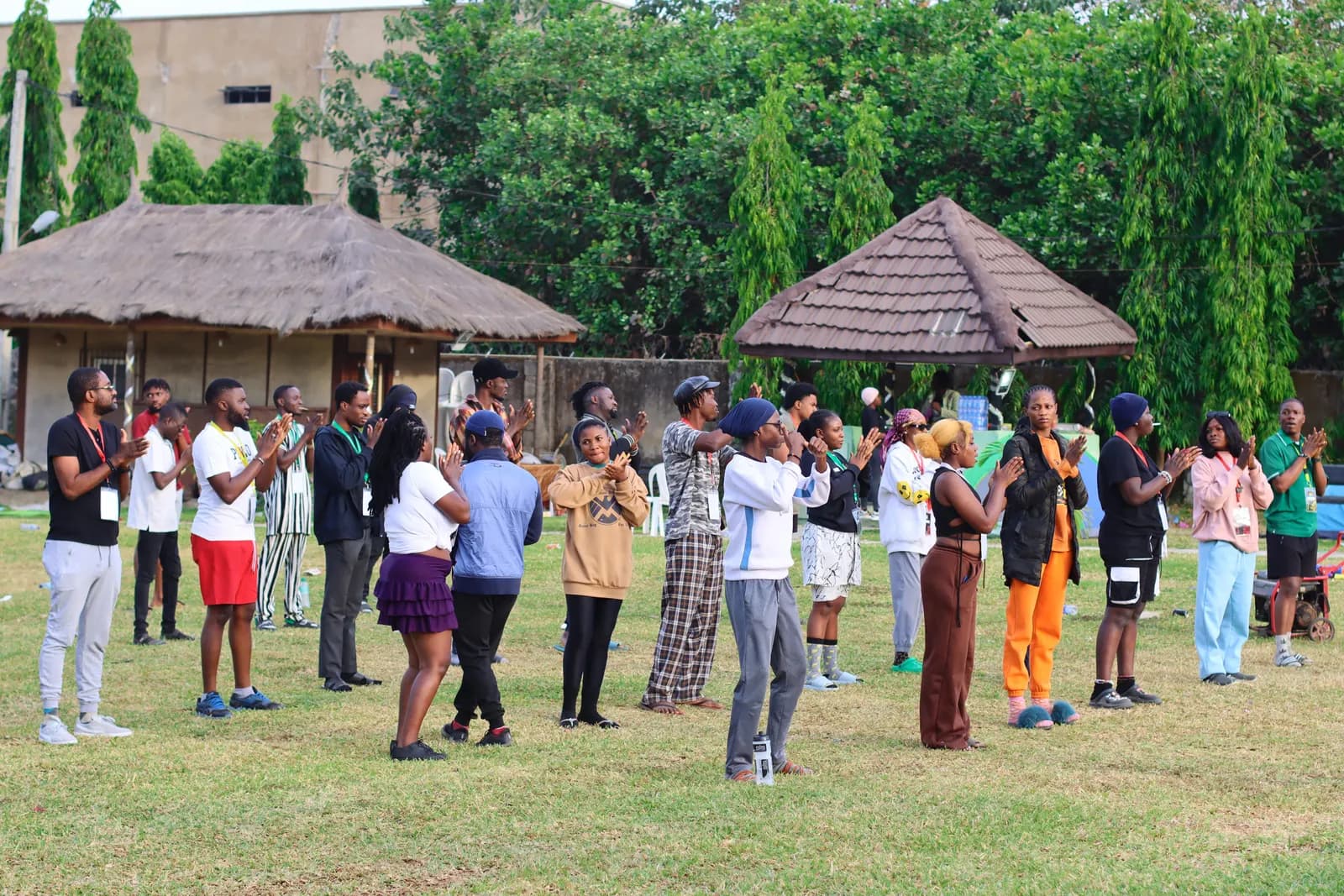Members on the lawn following a leader in a group activity