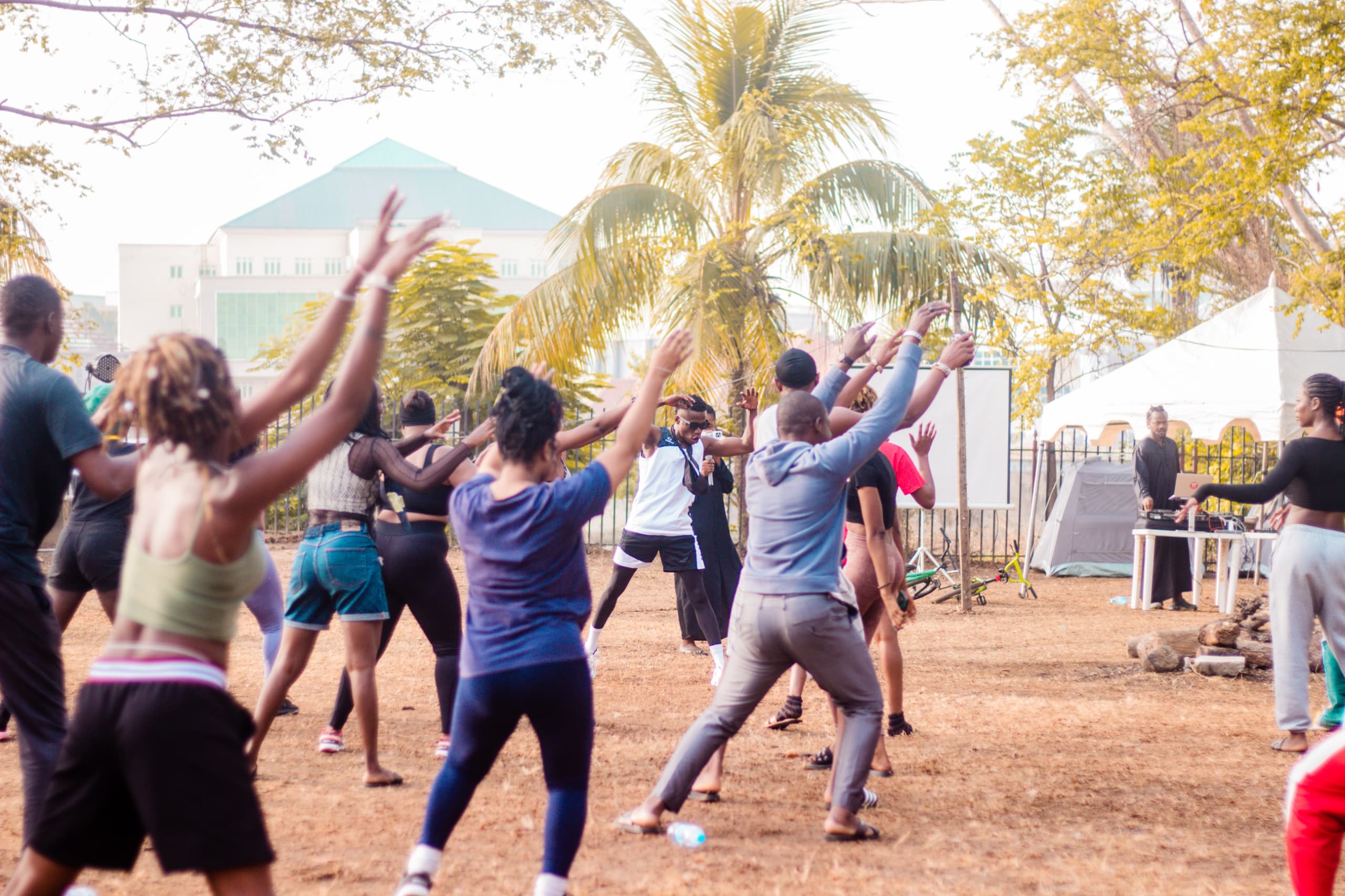 Young people doing group outdoor exercises and activities in Nigeria